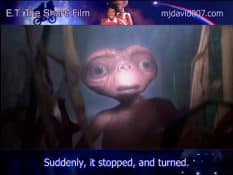 E.T. the Extra-Terrestrial is surpried by a flash light