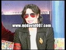 Michael Jackson wearing a red bracelet